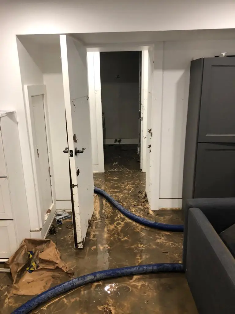 Sewage backup damage in a Toronto basement — professional emergency sewer cleanup required