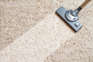 Dirty carpet being vacuumed